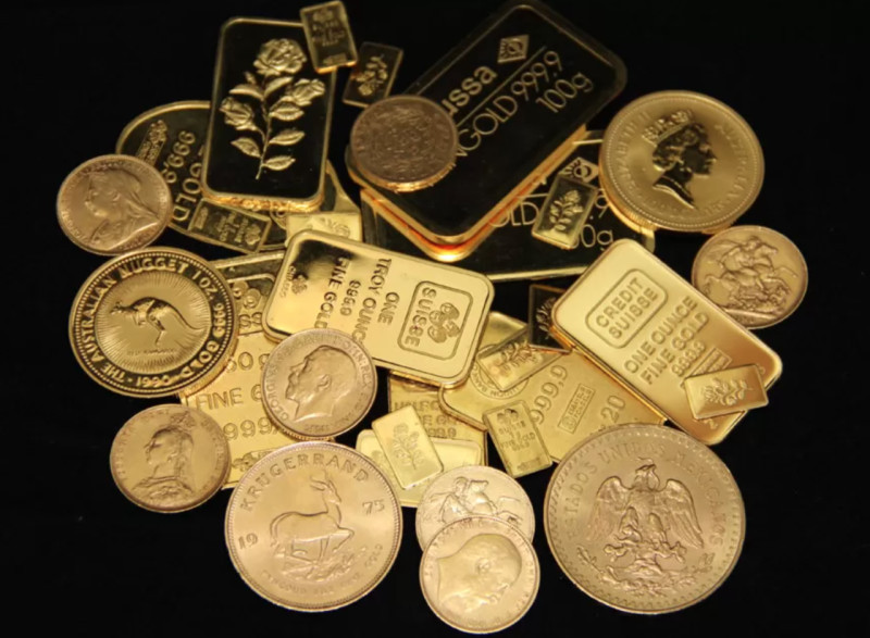 The illustration displays gold bars and investment coins.